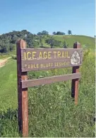  ?? CHELSEY LEWIS/ MILWAUKEE JOURNAL SENTINEL ?? The Ice Age Trail travels through restored prairie at Table Bluff. The Mammoth Tracks app is a great resource for the trail.