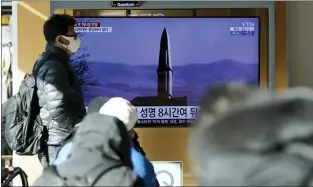  ?? LEE JIN-MAN — THE ASSOCIATED PRESS ?? A TV news program reporting about North Korea’s missile launch with a file image at a train station in Seoul, South Korea, on Monday. North Korea fired two suspected ballistic missiles into the sea.