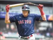  ?? Nic Antaya / Getty Images ?? The Red Sox’s Hunter Renfroe breaks a baseball bat over his head against the Detroit Tigers during the top of the fourth inning on Thursday in Detroit.