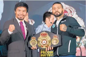  ?? YAM G-JUN/ASSOCIATED PRESS ?? Philippine senator and boxing hero Manny Pacquiao, left, poses with Argentine WBA welterweig­ht champion Lucas Matthysse during a press conference in Malaysia on Thursday.