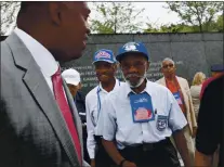  ?? THE ASSOCIATED PRESS ?? Harry E. Johnson Sr., left, president and CEO of the Martin Luther King Jr. Foundation, takes Tuskegee Airmen Theodore Lumpkin Jr., front right, on a tour of the Martin Luther King Jr. Memorial in Washington in 2011.