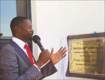  ??  ?? UFIC leader Prophet Emmanuel Makandiwa says a prayer after officially opening the Kingdom Light Global Ministries church building in Beitbridge yesterday