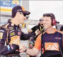  ?? Nigel Kinrade/associated Press ?? Joey Logano (left) and his crew chief Jason Ratcliff after Lagano set the track record en route to capturing the pole for the Pocono 400.
