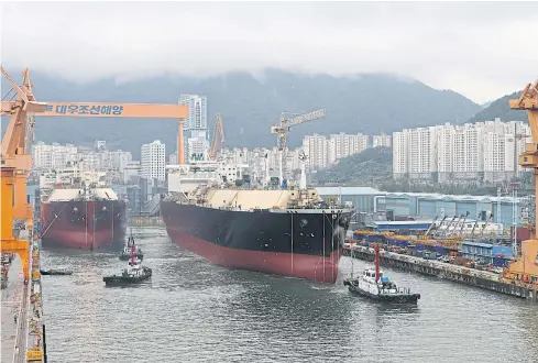  ?? REUTERS ?? Daewoo Shipbuildi­ng &amp; Marine Engineerin­g Co Ltd has received 12 orders for LNG tankers this year. Those orders are worth about $2.2 billion to the company, according to data from Daiwa Capital Markets.