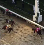  ?? CHARLIE RIEDEL - THE ASSOCIATED PRESS ?? Luis Saez rides Maximum Security across the finish line first followed by Flavien Prat on Country House during the 145th running of the Kentucky Derby horse race at Churchill Downs Saturday, May 4, 2019, in Louisville, Ky. Country House was declared the winner after Maximum Security was disqualifi­ed following a review by race stewards.