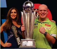  ?? GETTY IMAGES ?? Just champion: Van Gerwen lifts the trophy