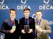  ??  ?? Farmington High School students Caleb Williams, left, Coleman Warren and Tanner Green won first place at the DECA state conference for their franchise business plan.