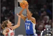  ?? AARON DOSTER — THE ASSOCIATED PRESS ?? Duke guard Reigan Richardson, right, is fouled by Ohio State guard Jacy Sheldon, left, as she rebounds the ball during the first half of a second-round game in the women's NCAA Tournament on Sunday in Columbus, Ohio.