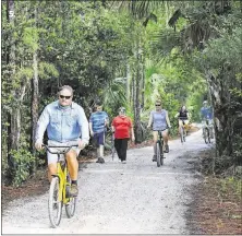  ?? LANNIS WATERS / THE PALM BEACH POST ?? Bike the trails of Jupiter’s Riverbend Park at night during a full moon this Friday.