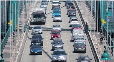  ?? DARRYL DYCK / THE CANADIAN PRESS ?? Traffic crosses over the Lions Gate Bridge from North Vancouver into Vancouver. Any solution to congestion must put a price on road use, writes Andrew Coyne.