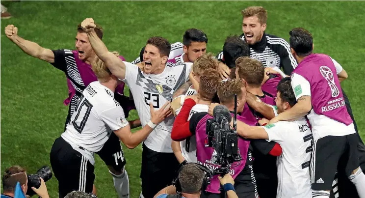  ?? GETTY IMAGES ?? German midfielder Toni Kroos celebrates with team-mates after scoring the dramatic winning goal in injury time against Sweden.