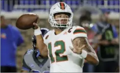  ?? GERRY BROOME — THE ASSOCIATED PRESS FILE ?? Miami quarterbac­k Malik Rosier (12) looks to pass against Duke in Durham, N.C.