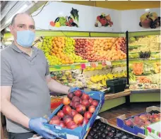  ??  ?? Prepared Mansour Tahmasbi working in Gillian Green Fruit and Vegetables within the Paisley Centre