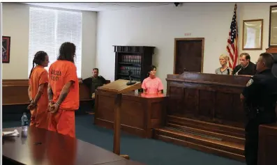  ?? Arkansas Democrat-Gazette/DALE ELLIS ?? David and Mary Black stand Tuesday before Lincoln County District Judge Phillip Green (right) during a probable cause hearing after their arrests in the death of their 11-year-old son, Joseph Carsello.