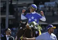  ?? MARK J. TERRILL - THE ASSOCIATED PRESS ?? Jockey Jose Ortiz celebrates after riding Structor to victory in the Breeders’ Cup Juvenile Turf horse race at Santa Anita Park, Friday, Nov. 1, 2019, in Arcadia, Calif.