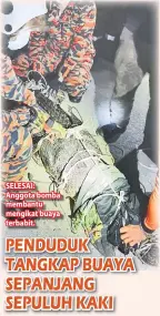  ??  ?? SELESAI: Anggota bomba membantu mengikat buaya terbabit.