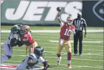  ?? BILL KOSTROUN — THE ASSOCIATED PRESS ?? San Francisco 49ers quarterbac­k Jimmy Garoppolo (10) throws a pass during the first half against the Jets on Sept. 20 in East Rutherford, N.J.