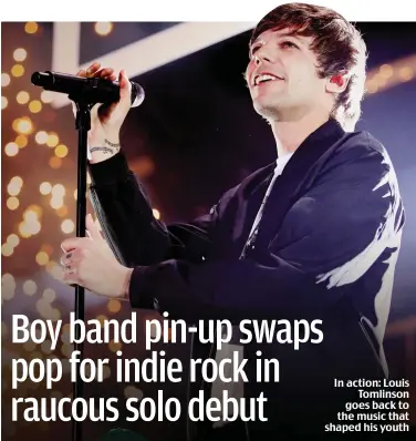  ??  ?? In action: Louis Tomlinson goes back to the music that shaped his youth