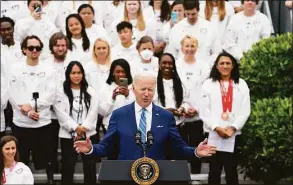  ?? Evan Vucci / Associated Press ?? President Joe Biden speaks during an event with the Tokyo 2020 Summer Olympic and Paralympic Games, and Beijing 2022 Winter Olympic and Paralympic Games, on the South Lawn of the White House Wednesday in Washington.