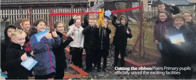  ??  ?? Cutting the ribbon Plains Primary pupils officially unveil the exciting facilities