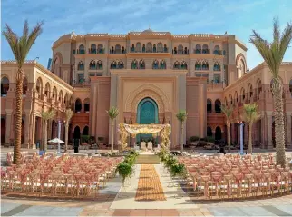  ?? ?? Clockwise: The Emirates Palace Wedding specialist­s weave magic with regal wedding setups; Strike a pose at the grand staircase of the hotel; Host a memorable beachside wedding under the starry sky or a royal soirée at the palatial Ballroom, options are a plenty