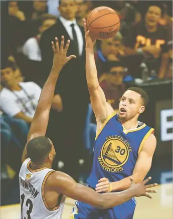  ?? Jay Laprete AFP/Getty Images ?? GOLDEN STATE’S Stephen Curry shoots over Cleveland forward Tristan Thompson during Game 4 of the NBA Finals. Curry answered a couple of days’ criticism with a 38-point, six-assist performanc­e.