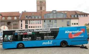  ?? (Reuters) ?? THE ELECTION-CAMPAIGN bus of Germany’s far-right Alternativ­e for Deutschlan­d (AfD) party is seen in Frankfurt earlier this month.