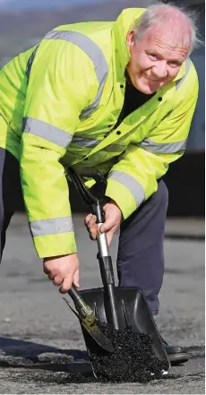  ??  ?? Getting his hands dirty: Roy Owen at work yesterday