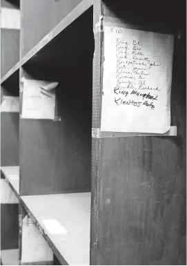  ?? [PHOTO BY DOUG HOKE, THE OKLAHOMAN] ?? Wine bottle storage racks still display the names of prominent Cellar patrons, including the late oilman and philanthro­pist John Kirkpatric­k.