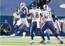  ?? ADRIAN KRAUS/AP ?? A second-half pick six by Taron Johnson helped the Bills beat the Ravens 17-3 on Saturday night and advance to their first AFC championsh­ip game in 27 years.