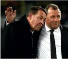  ??  ?? Steve Hansen, left, gets a pat on the back from assistant coach Ian Foster after the impressive win at Eden Park.