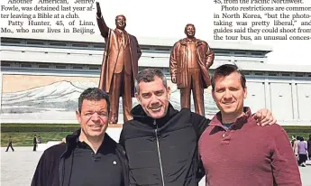  ??  ?? MICHAEL KEOGH MICHAEL KEOGH From left, Mark Smerznak, 43, Bruce Aitken, 45, and Mike Keogh, 44, stand in front of giant statues of Kim Il Sung and Kim Jong Il on Monday.