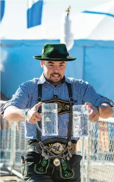  ?? ?? Josh Meck of Oley competes in the Stein Races during 2019’s Oktoberfes­t at Artsquest’s SteelStack­s in Bethlehem.