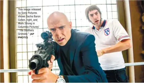  ?? (AP
PHOTO) ?? This image released by Sony Pictures shows Sacha Baron Cohen, right, and Mark Strong in Columbia Pictures’ “The Brothers Grimsby.”