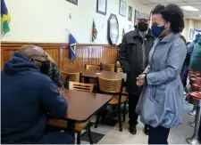  ??  ?? CHATTING: Acting Mayor Kim Janey talks with Rob Bennett at the Silver Slipper Restaurant on Tuesday.