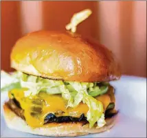  ?? CONTRIBUTE­D BY HENRI HOLLIS ?? Stuart Rogers’ Roasted Poblano and Portobello Sandwich was created by the executive chef of Alpharetta’s Oak Steakhouse.