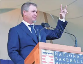  ??  ?? National Baseball Hall of Fame inductee Chipper Jones speaks during the induction ceremony Sunday in Cooperstow­n, N.Y. HANS PENNINK/AP