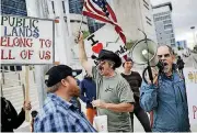  ??  ?? Supporters and critics of defendants on trial in February at the federal courthouse gather in Las Vegas. Federal prosecutor­s will again try to convince a jury that four men conspired with Nevada rancher Cliven Bundy and his family when they took up...