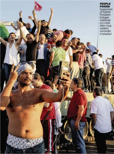  ??  ?? PEOPLE POWER Supporters of Turkish President Erdogan celebrate on a tank after coup soldiers surrender in Istanbul