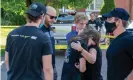  ?? Photograph: Canadian Press/REX/Shuttersto­ck ?? Friends of victims in a shooting at a home on Parklane Avenue in Oshawa, Ontario, react after laying flowers on Friday.