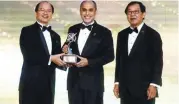  ??  ?? Mohd Shukri receiving the award from Minister of Science, Technology & Innovation Datuk Wilfred Madius Tangau. On the right is Enterprise Asia chairman Tan Sri Dr Fong Chan Onn.