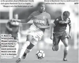  ?? AFP PHOTO ?? Monaco’s forward Kylian Mbappe controling the ball during a friendly football match between AS Monaco and Stoke City FC in Martigny.