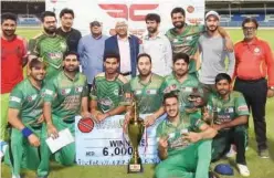  ??  ?? ↑
MGM Orakzai players pose with the trophy after winning the final match of the Sharjah Fit Capital Cup at the Sharjah Cricket Stadium.
