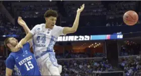  ?? BRANDON DILL — THE ASSOCIATED PRESS ?? North Carolina forward Justin Jackson loses the ball against Kentucky forward Isaac Humphries on March 26 in Memphis, Tenn.