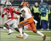  ?? ASSOCIATED PRESS FILE ?? Ohio State receiver Parris Campbell, left, fends off Illinois defensive back Nate Hobbs during a 2017 game in Columbus.