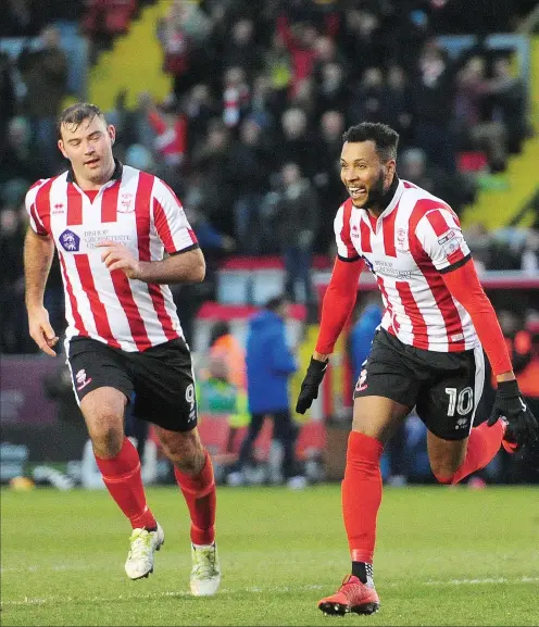  ?? PICTURES: Andrew Vaughan ?? JOY: Lincoln City’s Matt Green, right, celebrates scoring the opening goal with team-mate Matt Rhead