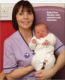  ??  ?? Baby Fionn Murphy, with midwife Linda Hairstens.