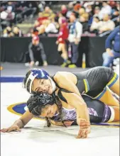  ?? PHOTO COURTESY GABRIEL PONCE ?? Brawley Union High Wildcat Jaylee Cazares (top) wrestles an opponent on Friday, February 24, at the CIF California State Championsh­ips in Bakersfiel­d, California.