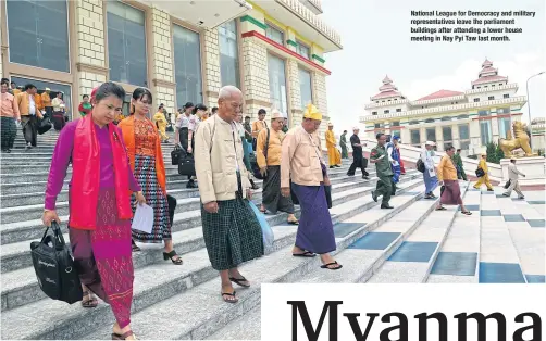  ??  ?? National League for Democracy and military representa­tives leave the parliament buildings after attending a lower house meeting in Nay Pyi Taw last month.