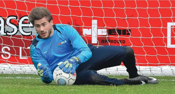  ?? SEAN HERNON/PPAUK ?? Torquay manager has a decision to make between goalkeeper Shaun McDonald (above) and fit-again Alex Bass